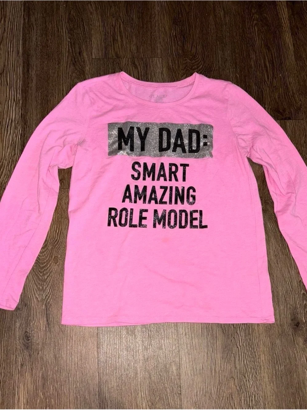 Pink long sleeve shirt with sparkly text
